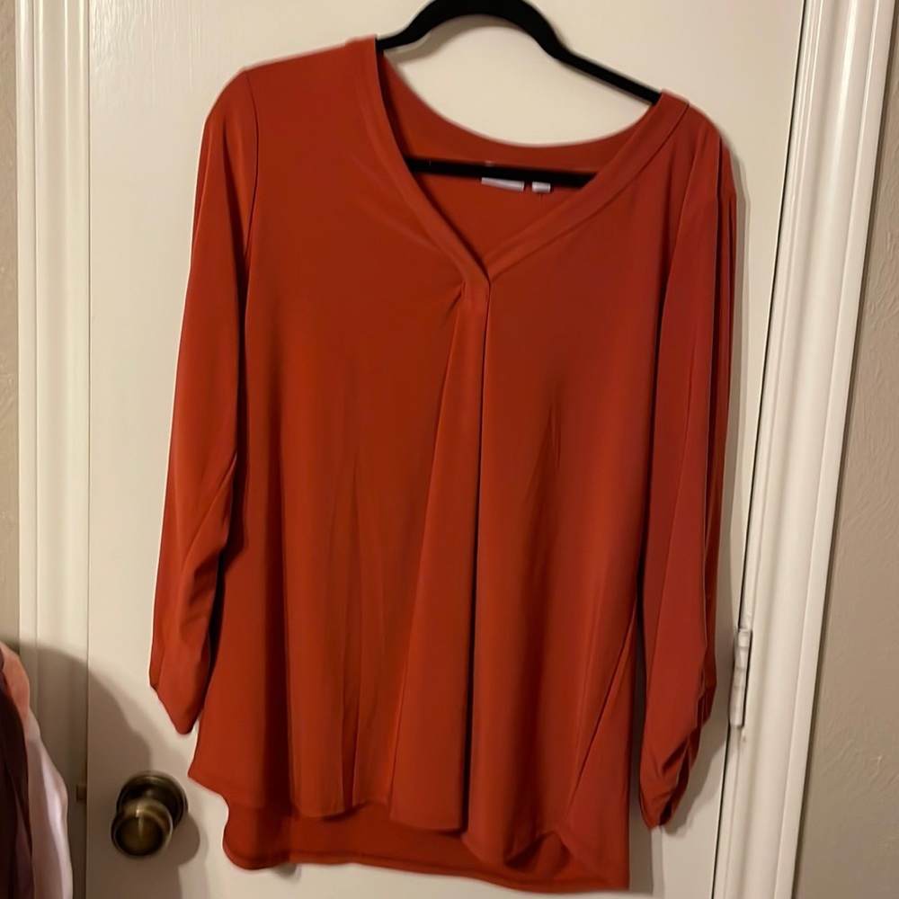 Beautiful rust colored blouse bought from Belk. Never worn